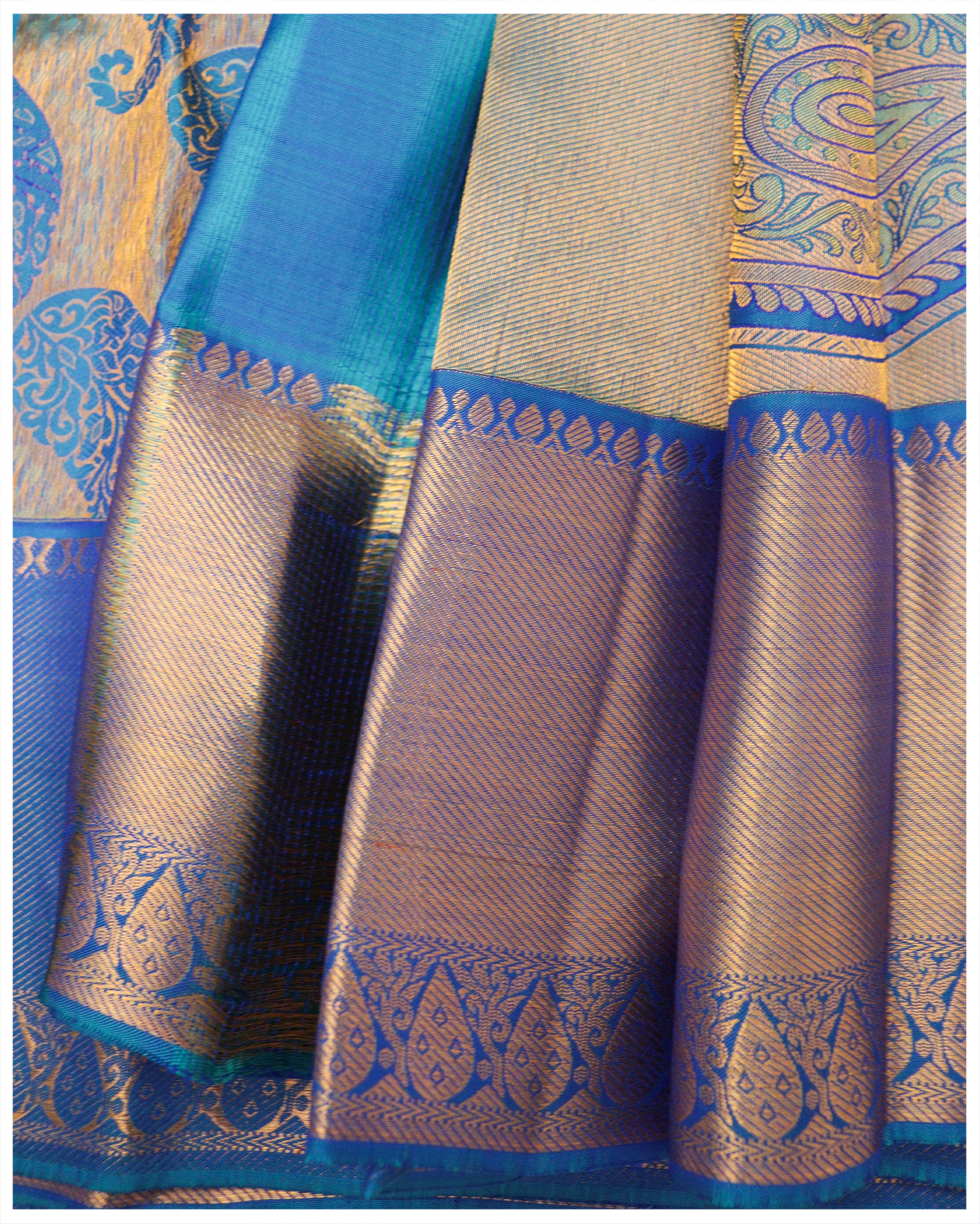 Kanjivaram Silk Saree in Peacock Blue with Zari Motifs & wide border in  Copeer | SILK MARK CERTIFIED | Contrasting colors, Silk sarees, Copper color